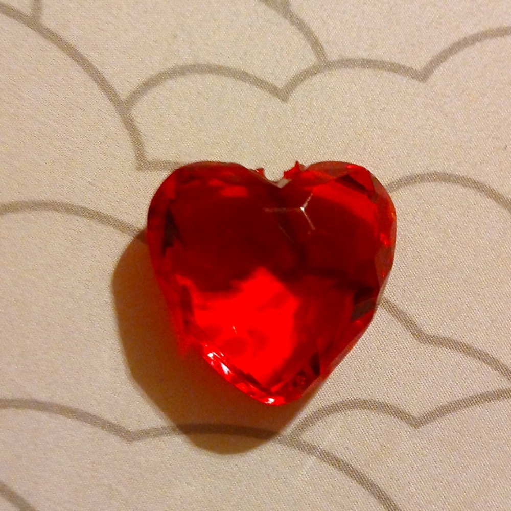 Heart-shaped plastic diamond.
